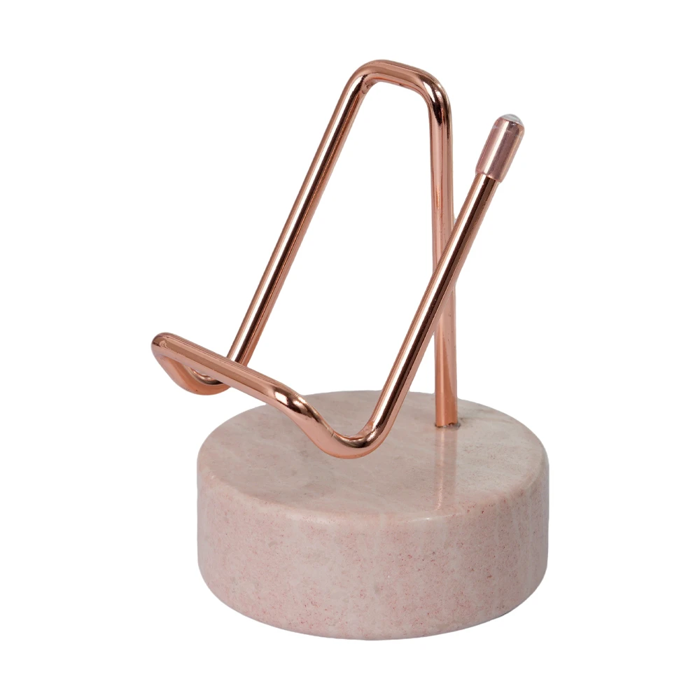 Soporte para tel&eacute;fono dorado con base de m&aacute;rmol rosa crema